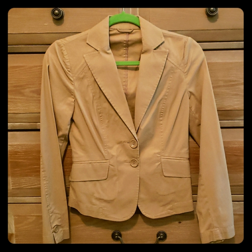 A tan colored Benetton Spring jacket